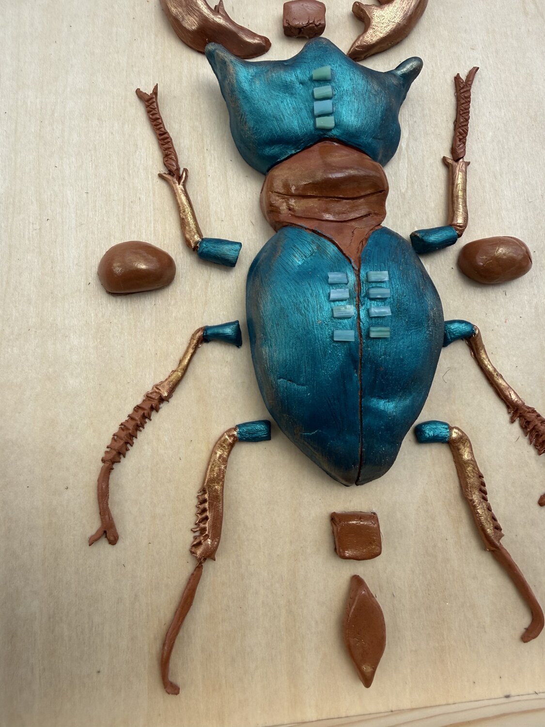 Teal scarabee — detail