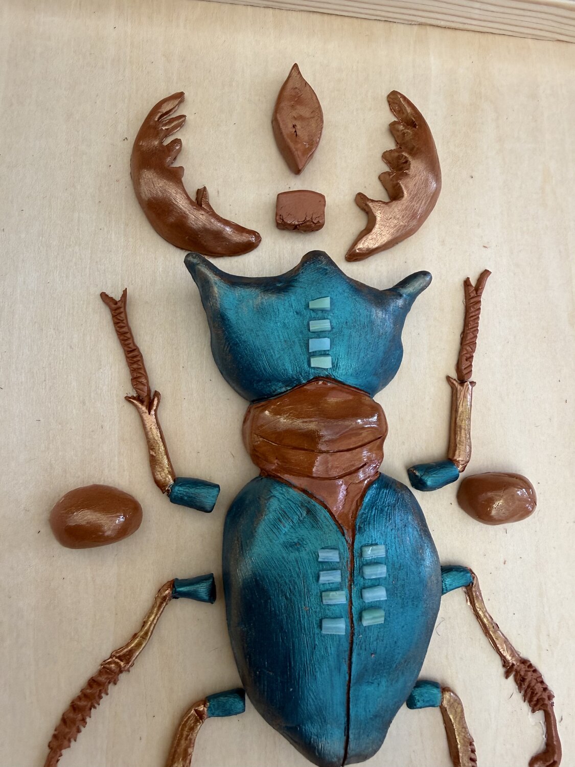 Teal scarabee — detail