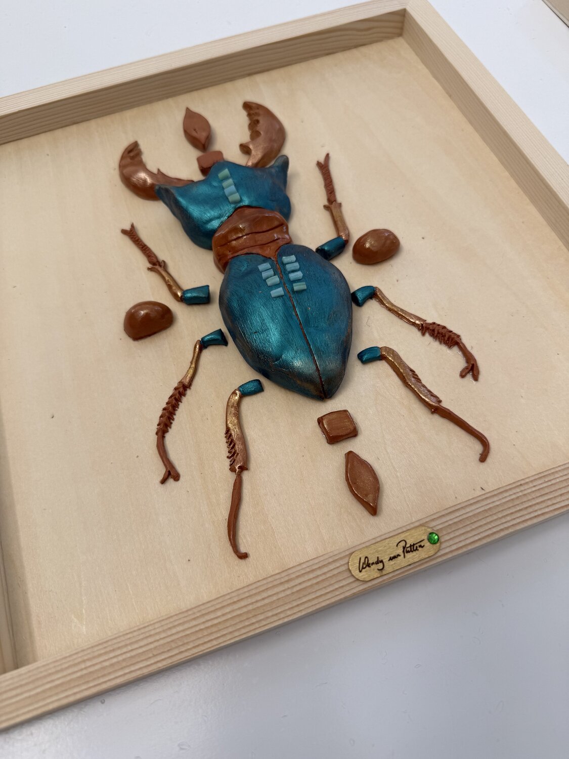 Teal scarabee — detail